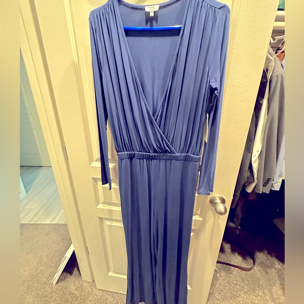Navy long sleeve jumpsuit. Size M. Tags on.